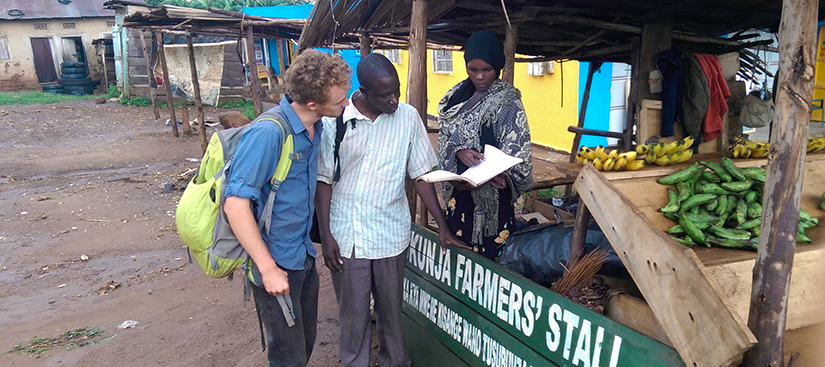 Consulting with a farmer during a previous Trellis Fund project led by the Mwino Group in Uganda, with Alex Greenspan of UC Davis.