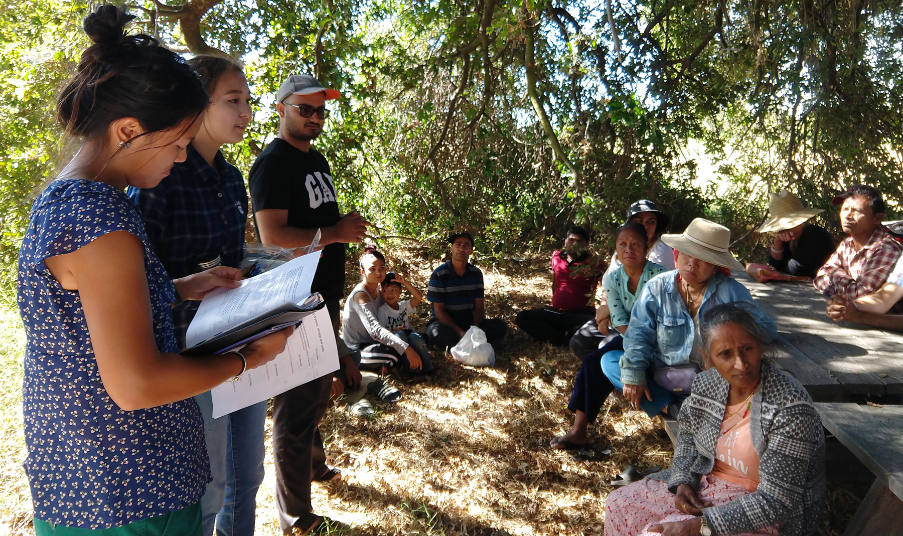 UC Davis students speak to refugee farmers at IRC New Roots farm in Sacramento