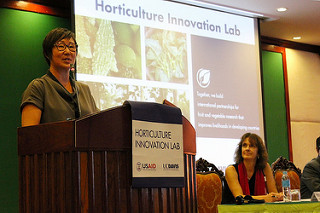 Lee at podium in front of a screen that reads "Horticulture Innovation Lab"