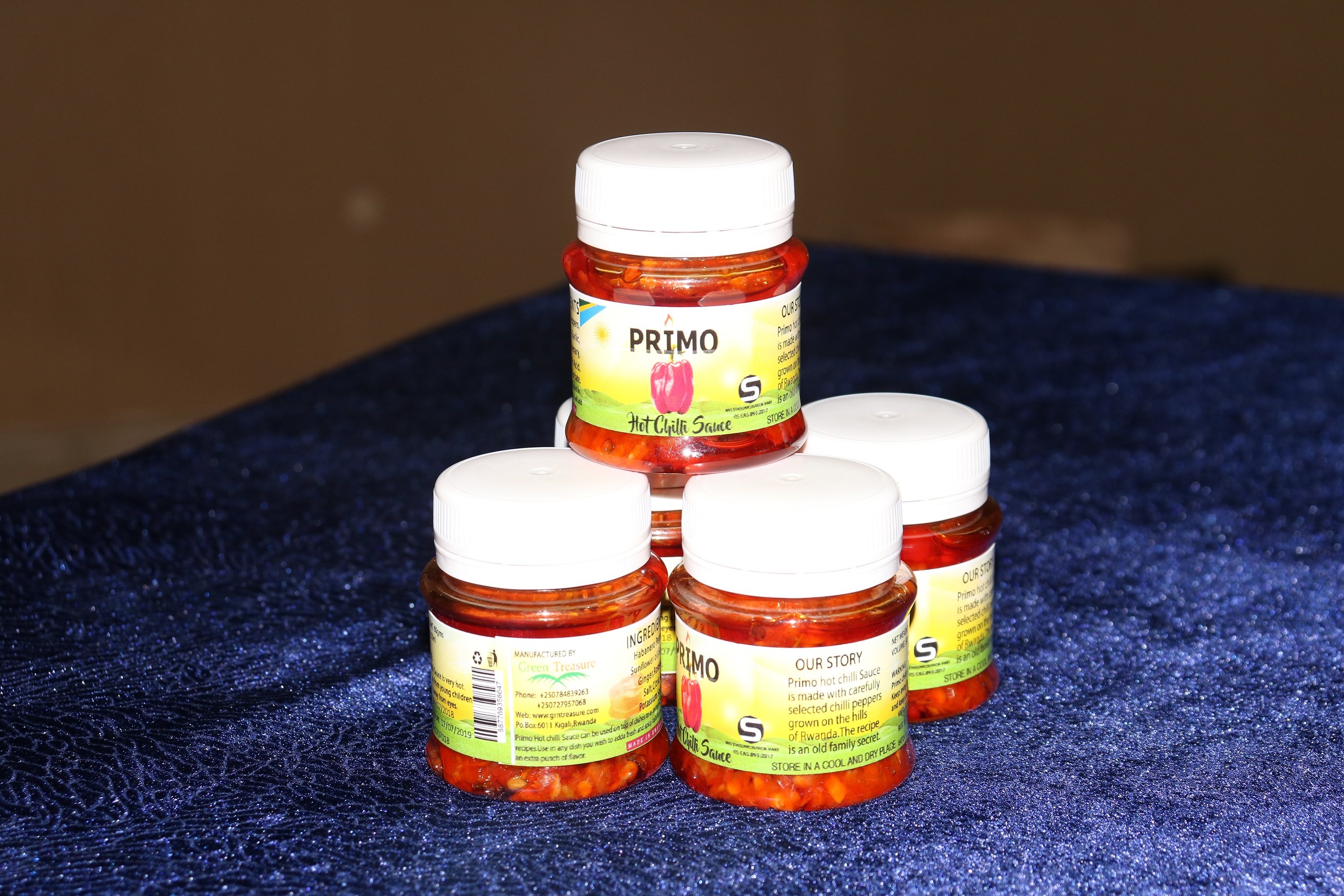 Several jars of Primo Chili Sauce