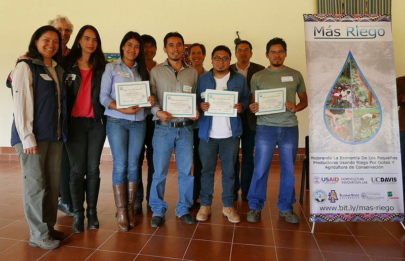 Group, smiling, with certificates by MasRiego banner