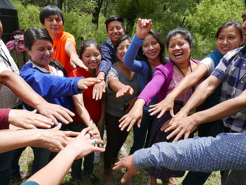 group gathered with hands out for a cheer