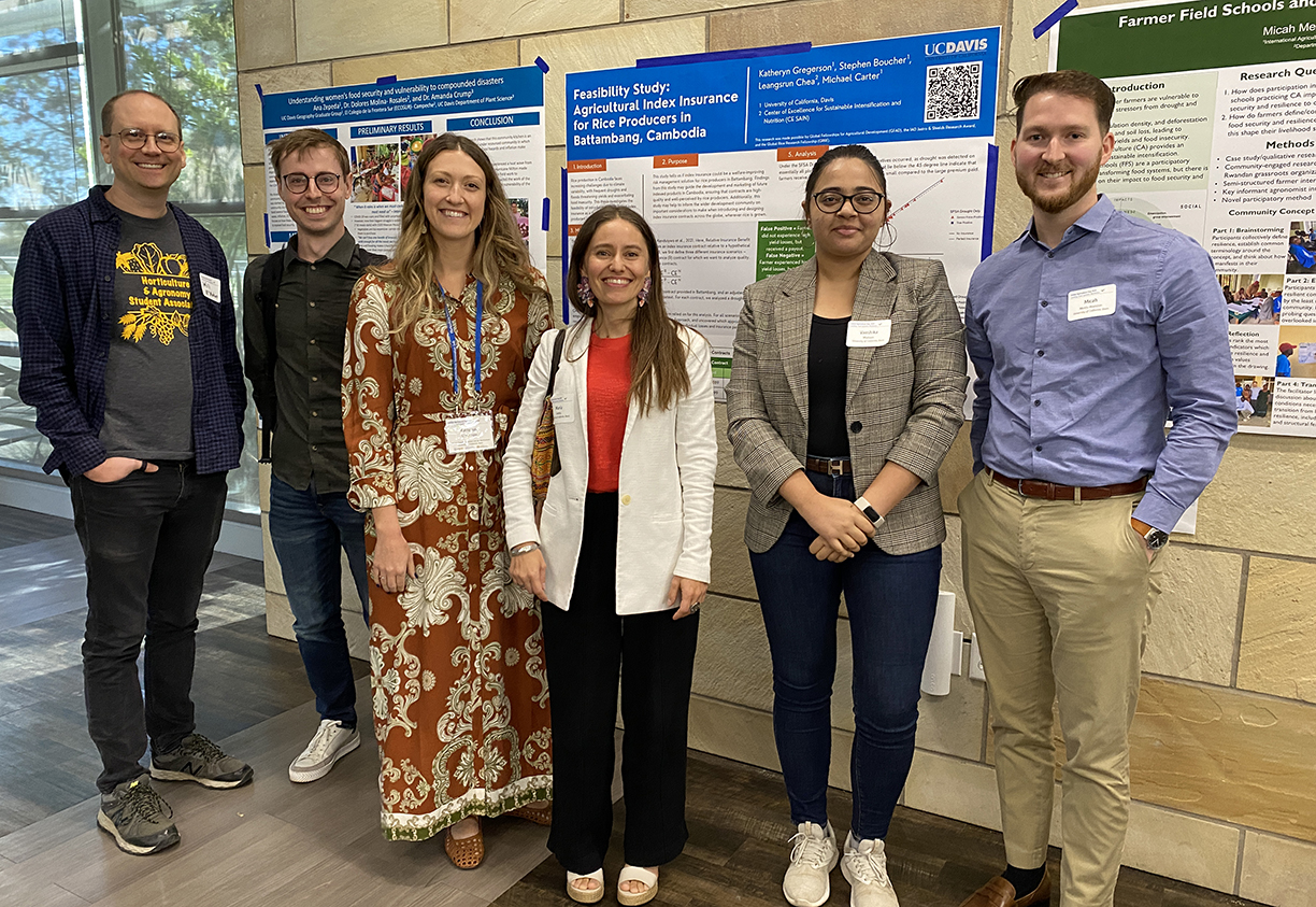 Students in front of academic posters.