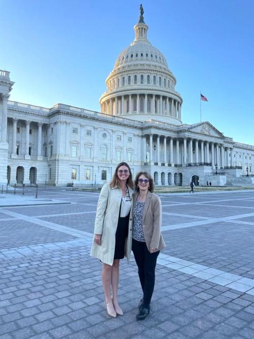 Two individuals in front of Capitol in Washington, DC