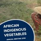 "African indigenous vegetables" text over woman with child in field of african indigenous vegetables